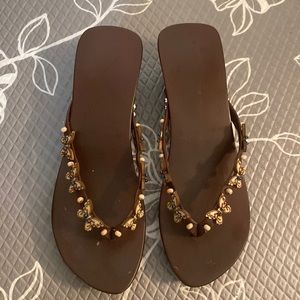 Wooden slipper bought in Japan with wooden butterflies decoration